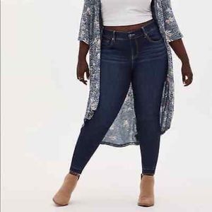 Torrid Bombshell Skinny Jeans with Raw Hem.